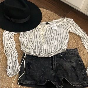 Shirt paired w black shorts